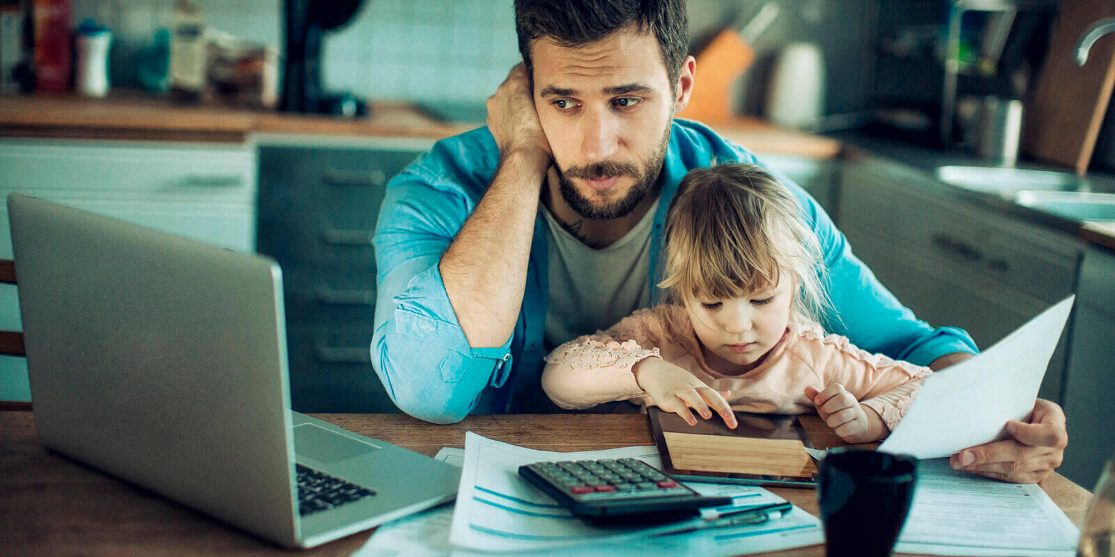 Man with a child trying to work