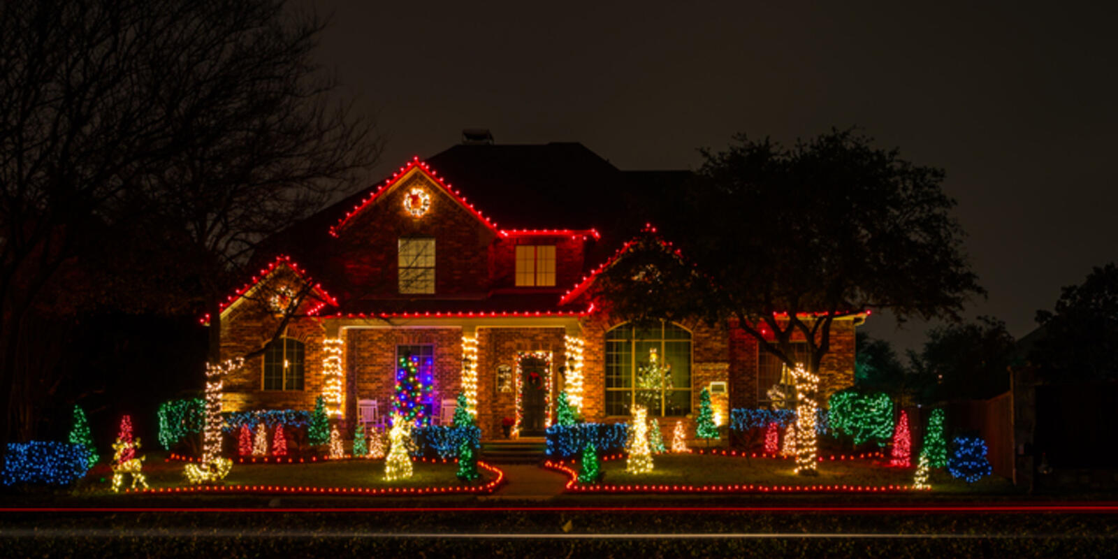 House decorated with Christmas lights at night