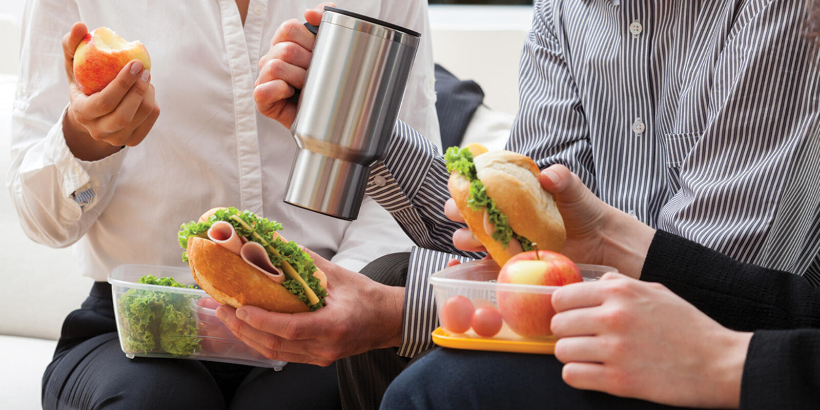 Workers eating lunch prepared at home