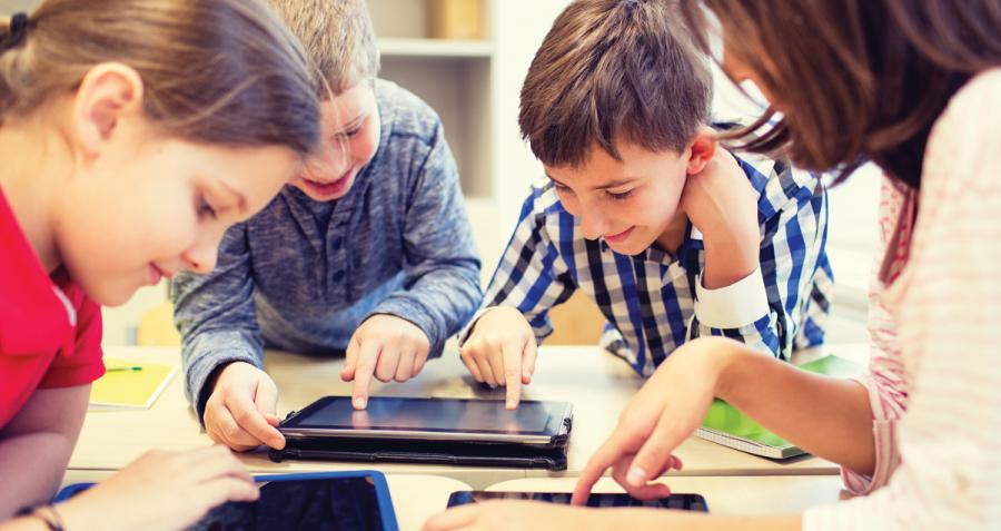 Schoolchildren using tablets