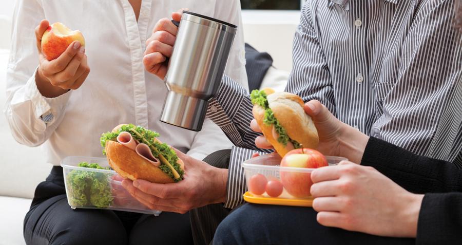 Workers eating lunch prepared at home